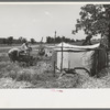 Camp of migratory workers who move along the road pushing their belongings in a cart, camped near Vian, Sequoyah County, Oklahoma