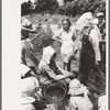 Local agricultural day laborers, potato workers, after a day's work near Spiro, Oklahoma