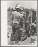 Receiving check for string beans picked at scales in field near Muskogee, Oklahoma