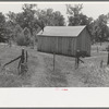 Home of agricultural day laborer near Sallisaw, Oklahoma. Notice absence of windows. Sequoyah County, Oklahoma