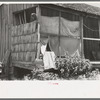 Porch of WPA (Work Projects Administration) worker who was tenant farmer until a few years ago, near Sallisaw, Oklahoma