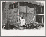 Porch of WPA (Work Projects Administration) worker who was tenant farmer until a few years ago, near Sallisaw, Oklahoma