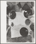 White migrant family eating lunch of blackberry pie on the highway, Muskogee County, east of Fort Gibson, Oklahoma