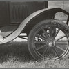 Detail of automobile of white migrant family with sack of salt on running board and leather-laced tire, Fort Gibson, Oklahoma