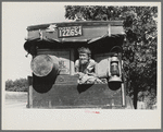 White migrant child sitting in back seat of family car east of Fort Gibson, Muskogee County, Oklahoma