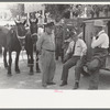 Farmers talking at market, Weatherford, Texas