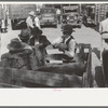 Farmers grouped around a calf in a trailer, farmers' market, Weatherford, Texas