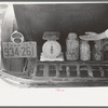 Seeds for sale on luggage carrier of automobile, farmers' market, Weatherford, Texas