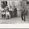 Group of residents of Weatherford, Texas, listening to politician speak