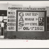 Sign at filling station which also sells liquor, Waco, Texas