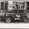 Geese in pen on side of car. Market Square,  Waco, Texas