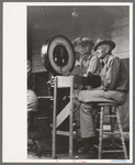 Weigher at poultry cooperative, Brownwood, Texas