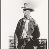 Cattleman at stockyard, San Angelo, Texas