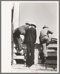 West Texas cattlemen looking over the cattle which are offered for sale, stockyards. San Angelo, Texas