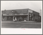 Sweeping off walk in early morning, grocery store, San Angelo, Texas