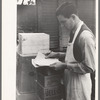 Checking delivery of supplies from wholesale grocery store. San Angelo, Texas
