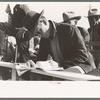 Clerk at horse auction. El Dorado, Texas