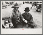 Farmer and son arriving in town in wagon, Eufaula, Oklahoma