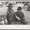 Farmer and son arriving in town in wagon, Eufaula, Oklahoma