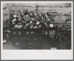 Oil cans at side of filling station, Eufaula, Oklahoma