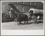 Old chuck wagon used for advertising purposes in parade which will open the San Angelo Fat Stock Show, San Angelo, Texas