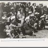 Spectators at a side show where a man unloosens himself from chains and ropes, San Angelo Fat Stock Show, San Angelo, Texas