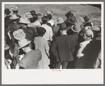 Backs of spectators at a sideshow, San Angelo Fat Stock Show, San Angelo, Texas