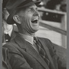 Spectator laughing at the antics of a cowboy clown at the rodeo of the San Angelo Fat Stock Show, San Angelo, Texas