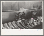 Cowboys eating breakfast at restaurant on the grounds of the San Angelo Fat Stock Show, San Angelo, Texas