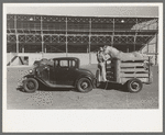 Rodeo performer arriving at the San Angelo Fat Stock Show barn with his horse in trailer, San Angelo, Texas