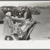 Souvenir vendor displaying his wares at the San Angelo Fat Stock Show, San Angelo, Texas