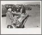 Souvenir vendor displaying his wares at the San Angelo Fat Stock Show, San Angelo, Texas