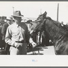 West Texan and his horse which he is displaying in show ring at the San Angelo Fat Stock Show, San Angelo, Texas