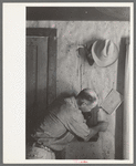 West Texas ranchman making a telephone call, Kimble County, Texas