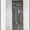 Closet space in apartment of family living and working at the Arizona Part-Time Farms, Chandler Unit, Maricopa County, Arizona