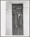 Closet space in apartment of family living and working at the Arizona Part-Time Farms, Chandler Unit, Maricopa County, Arizona