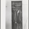 Closet space in apartment of family living and working at the Arizona Part-Time Farms, Chandler Unit, Maricopa County, Arizona