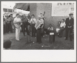 Orchestra playing outside a grocery store on Saturday afternoon which is designed to attract customers to the store, Phoenix, Arizona