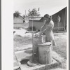 Garbage disposal and water supply at end of the row shelters in Agua Fria Migratory Labor Camp, Arizona