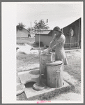 Garbage disposal and water supply at end of the row shelters in Agua Fria Migratory Labor Camp, Arizona