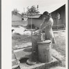 Garbage disposal and water supply at end of the row shelters in Agua Fria Migratory Labor Camp, Arizona