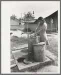 Garbage disposal and water supply at end of the row shelters in Agua Fria Migratory Labor Camp, Arizona