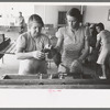 Wives of migratory laborers working in the laundry room at the Agua Fria Migratory Labor Camp, Arizona