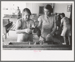 Wives of migratory laborers working in the laundry room at the Agua Fria Migratory Labor Camp, Arizona