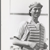 Migratory laborers like to play baseball. Here is one of them in a catchers uniform at the Agua Fria Migratory Labor Camp, Arizona