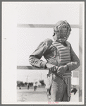 Migratory laborers like to play baseball. Here is one of them in a catchers uniform at the Agua Fria Migratory Labor Camp, Arizona