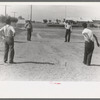 Pitching horseshoes at the Agua Fria Migratory Labor Camp, Arizona