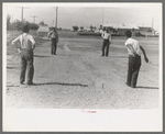 Pitching horseshoes at the Agua Fria Migratory Labor Camp, Arizona