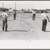 Pitching horseshoes at the Agua Fria Migratory Labor Camp, Arizona