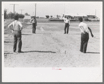 Pitching horseshoes at the Agua Fria Migratory Labor Camp, Arizona